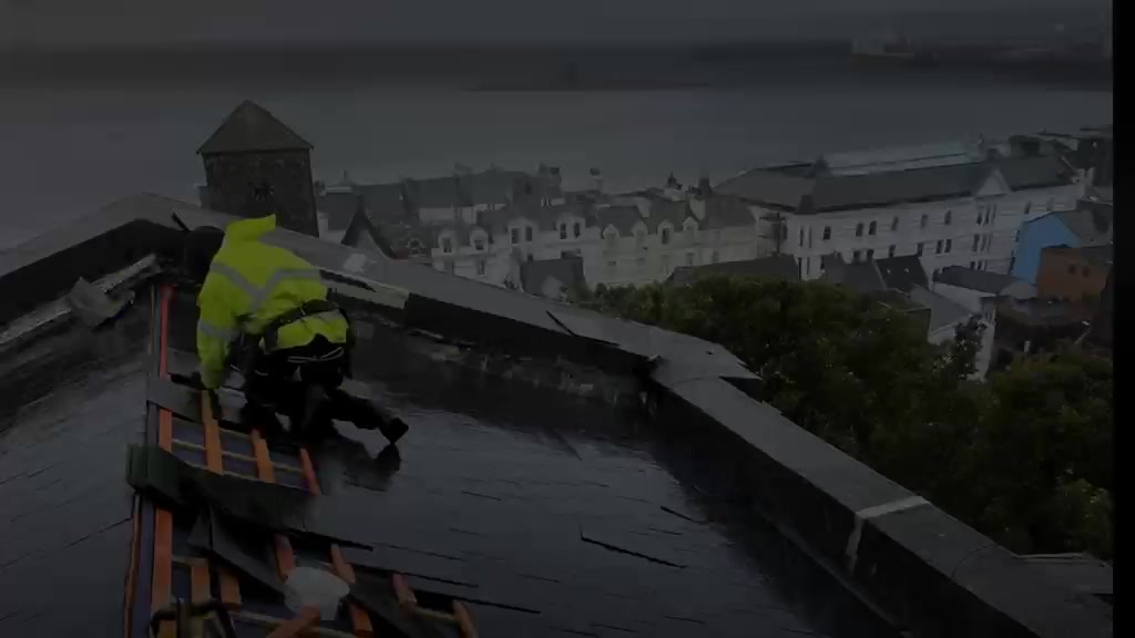 Firstman Roofing carrying out a slate re-roof overlooking Douglas Bay, Isle of Man