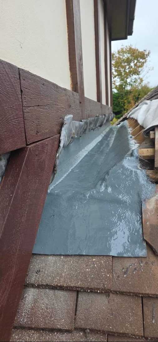 Lead flashing detail against timber cladding