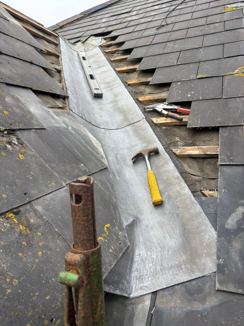 New lead valley flashing being installed