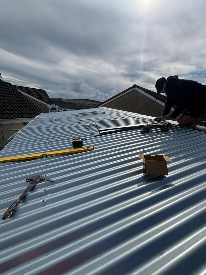 New box profile sheet roofing being installed