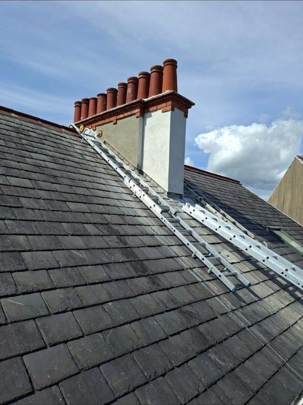 Multi-flue Victorian chimney stack with original pots