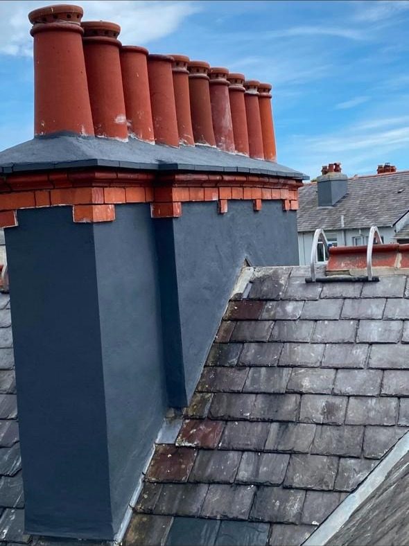 Freshly repainted chimney breast with original pots