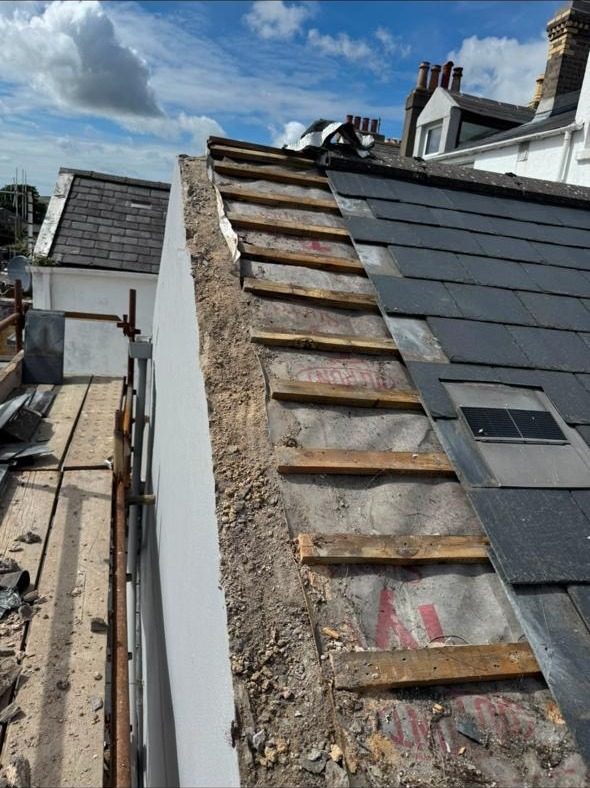 Battens and felt renewed along a parapet wall