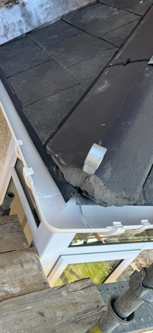 Storm-damaged slate corner ready for repair