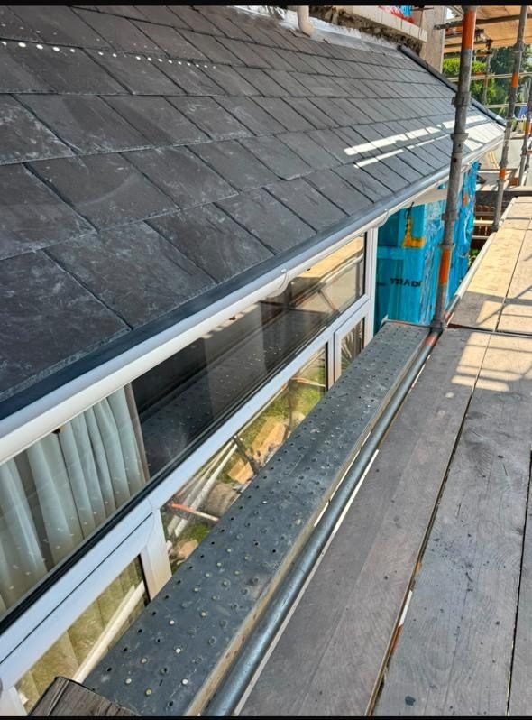 Finished slate roof edge along the scaffold