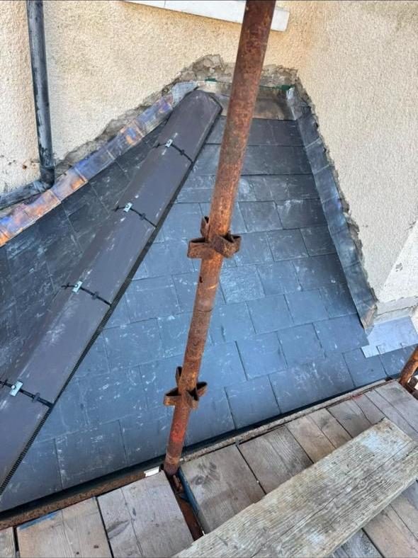 Roof valley re-slated with new lead flashing