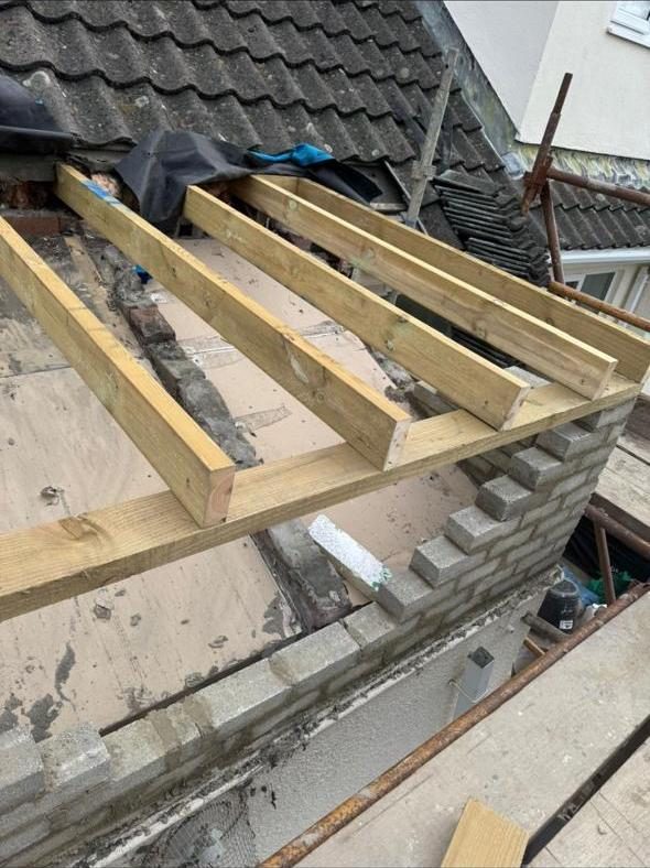 New timber joists fitted across the flat roof