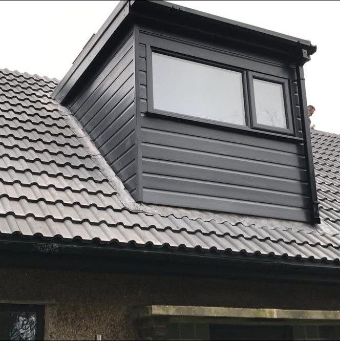 New dormer window conversion with black cladding