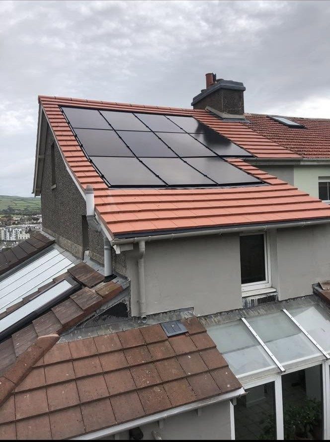 Solar panels installed on an existing tile roof
